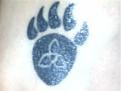 My first tattoo... I'm a mutt but I'm 'mostly' Scottish and Native so I thought I'd combine the two... That's a trinity knot there in the middle and among other things the bear paw symbolizes a closeness to the creator.